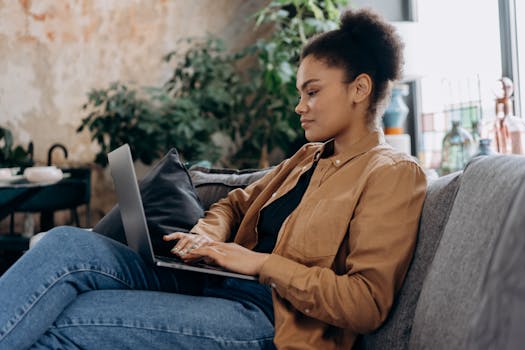 person using budgeting app on laptop