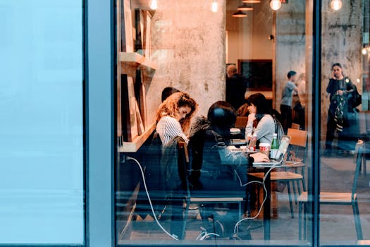 person working on a laptop at a cafe