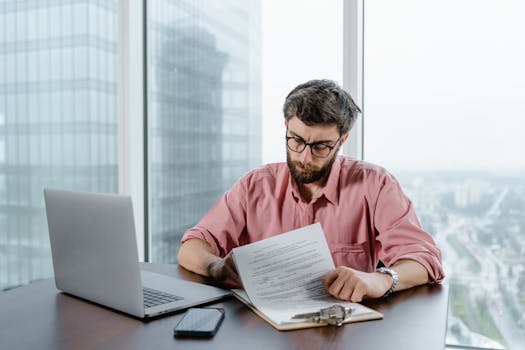 person reviewing job listings on a laptop