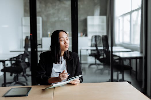 a person budgeting using a notebook