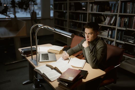 A student researching salary information on a laptop