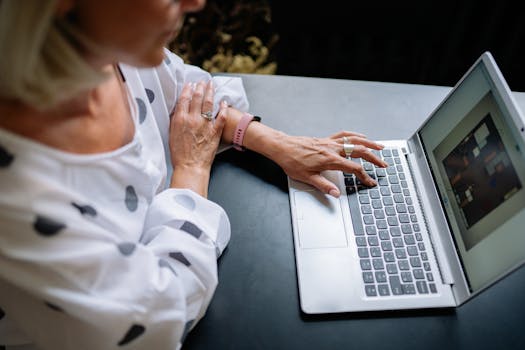 Image of a person working on a laptop