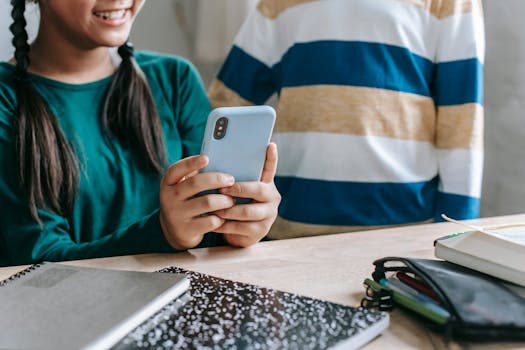 image of a student using a micro-investing app