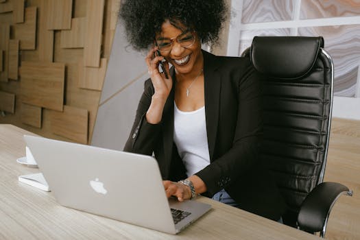 happy entrepreneur with laptop