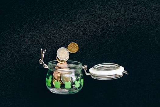 a person saving coins in a jar