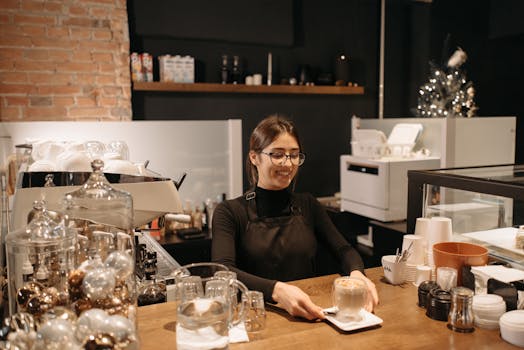 Friendly barista serving coffee