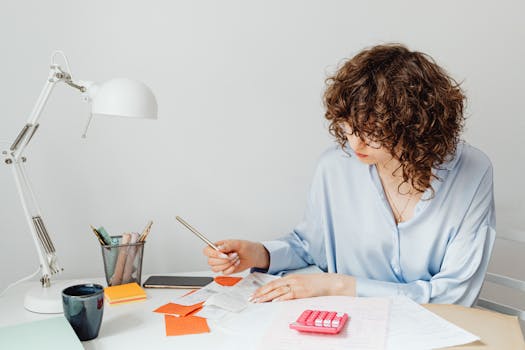 Person managing budget on a smartphone