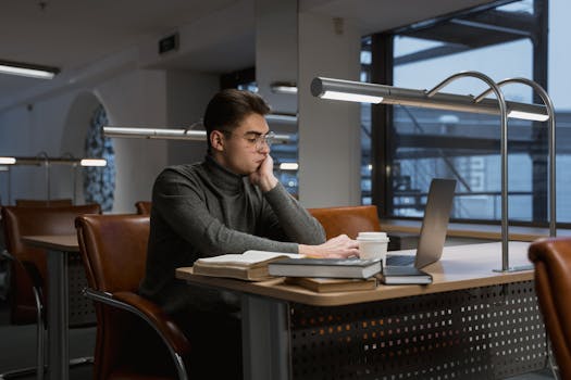 Student studying with a laptop and coffee